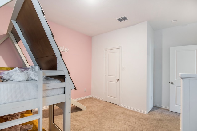 bedroom with light carpet