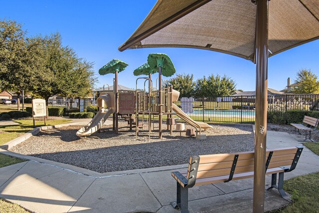 view of play area featuring a fenced in pool