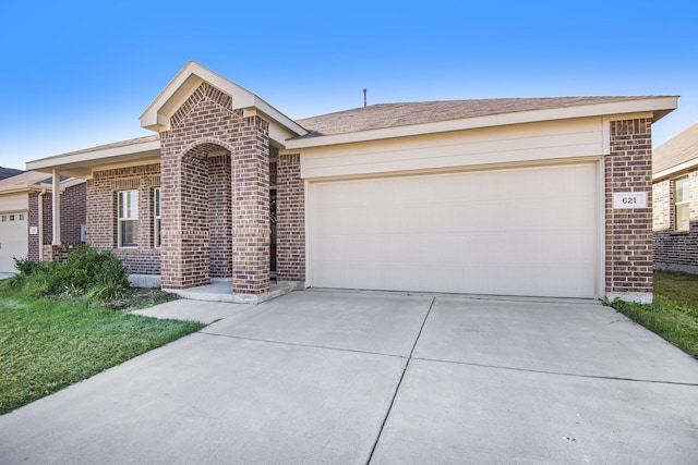 ranch-style home featuring a garage