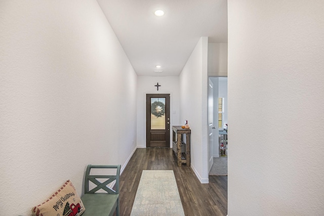 entryway with dark hardwood / wood-style floors