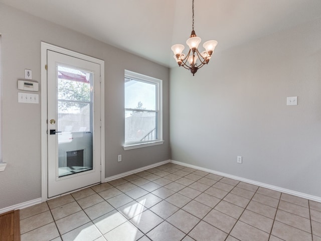 interior space featuring an inviting chandelier and light tile patterned flooring