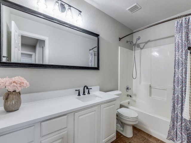 full bathroom featuring shower / bath combination with curtain, vanity, and toilet