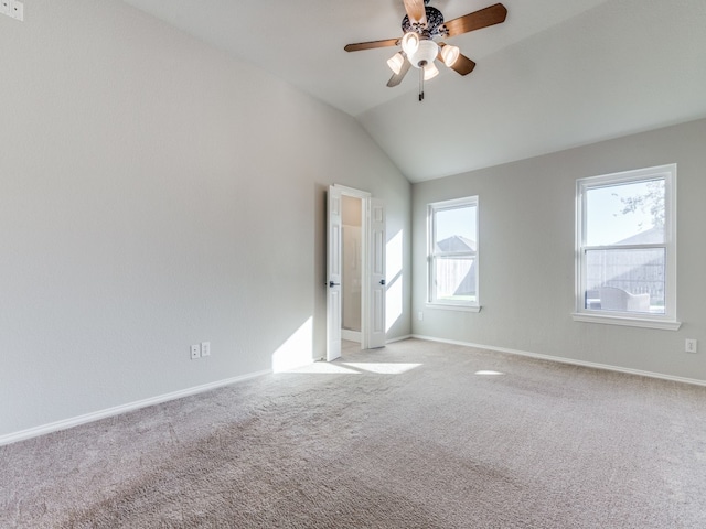 spare room with light carpet, lofted ceiling, and ceiling fan