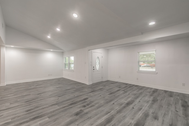 interior space featuring lofted ceiling and wood-type flooring