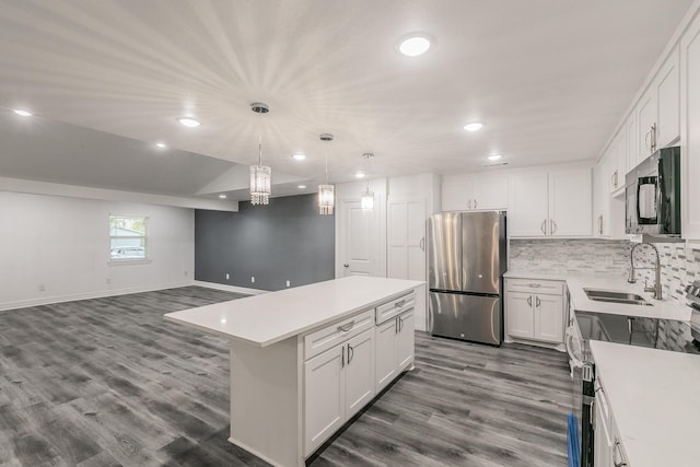 kitchen with a center island, white cabinets, and appliances with stainless steel finishes