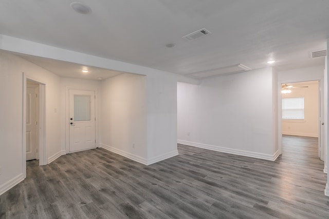 empty room with dark hardwood / wood-style floors