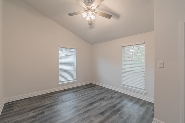 unfurnished room with vaulted ceiling, ceiling fan, and dark hardwood / wood-style flooring