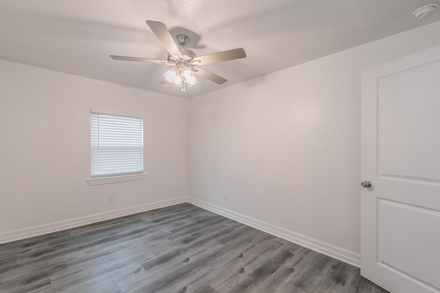 unfurnished room with dark hardwood / wood-style floors and ceiling fan