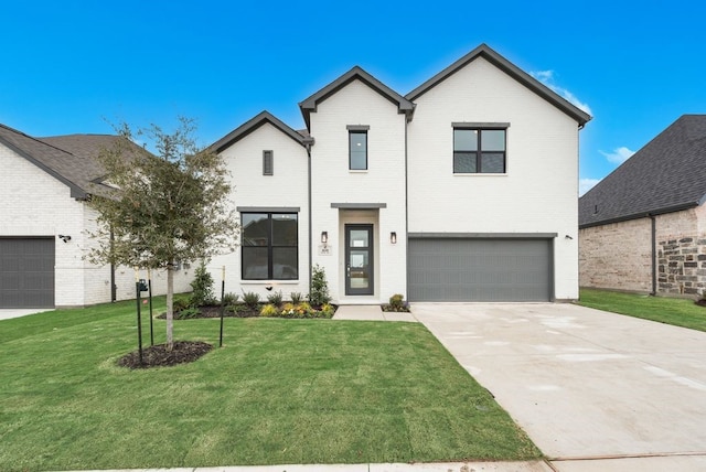 view of front of home featuring a garage and a front lawn