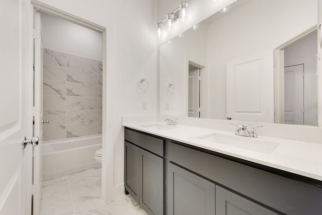 full bathroom with vanity, toilet, and tiled shower / bath combo