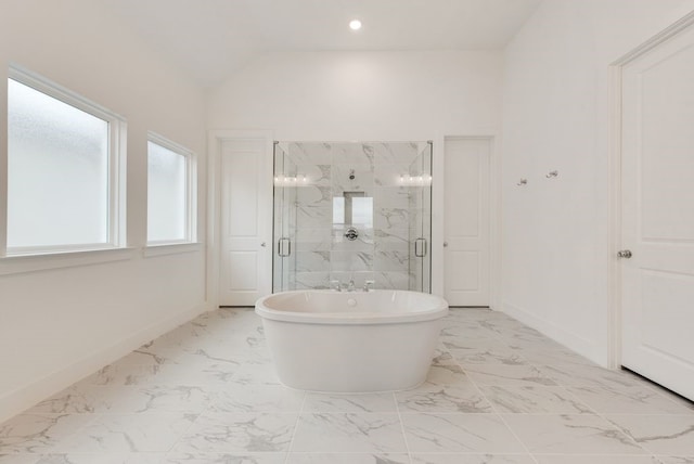 bathroom featuring separate shower and tub and lofted ceiling