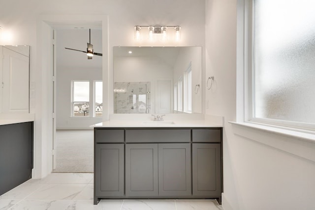 bathroom featuring ceiling fan and vanity