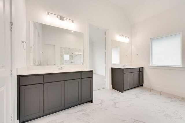 bathroom featuring a shower with shower door, lofted ceiling, and vanity