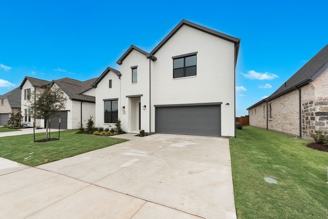 view of front facade with a garage and a front lawn