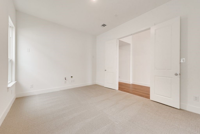 unfurnished bedroom with carpet flooring