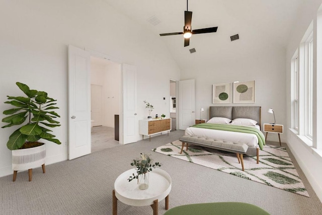 carpeted bedroom with ceiling fan and high vaulted ceiling