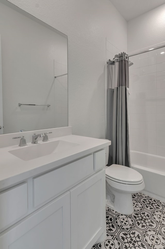 full bathroom featuring shower / tub combo with curtain, vanity, toilet, and tile patterned flooring