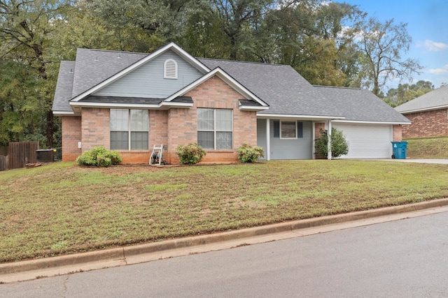 view of front facade featuring a front lawn and a garage