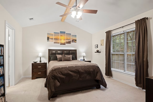 carpeted bedroom featuring lofted ceiling with beams and ceiling fan