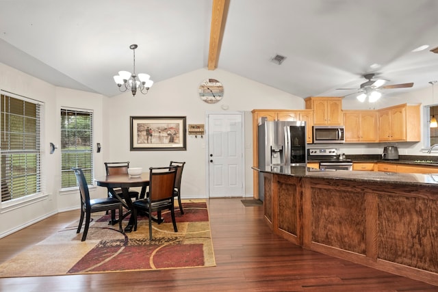 kitchen featuring ceiling fan with notable chandelier, dark wood-type flooring, hanging light fixtures, lofted ceiling with beams, and appliances with stainless steel finishes