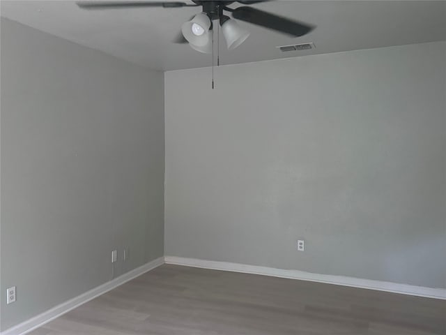 spare room featuring ceiling fan and wood-type flooring