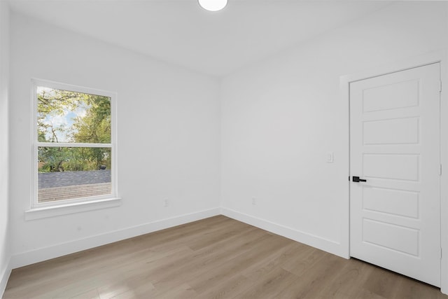 unfurnished room with light hardwood / wood-style flooring