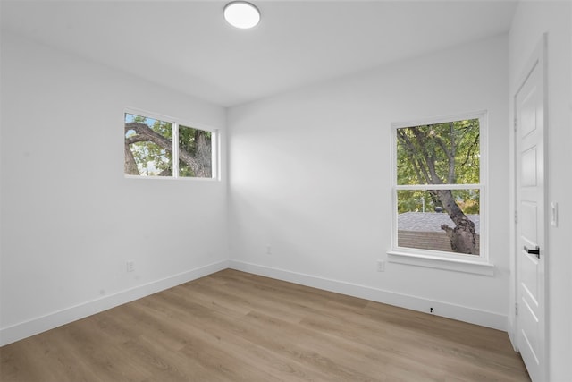 spare room with light wood-type flooring