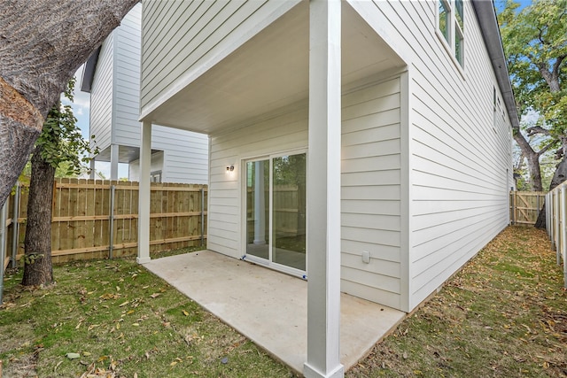 exterior space with a lawn and a patio