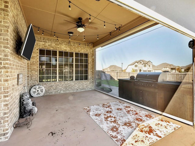 view of patio / terrace with an outdoor kitchen and ceiling fan