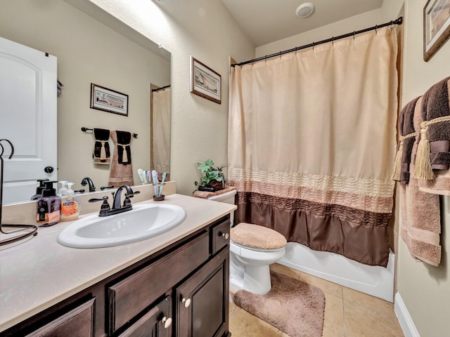 full bathroom with tile patterned flooring, shower / bath combo, vanity, and toilet