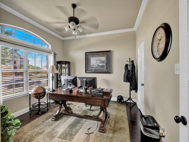 home office featuring ceiling fan, dark wood-type flooring, and ornamental molding