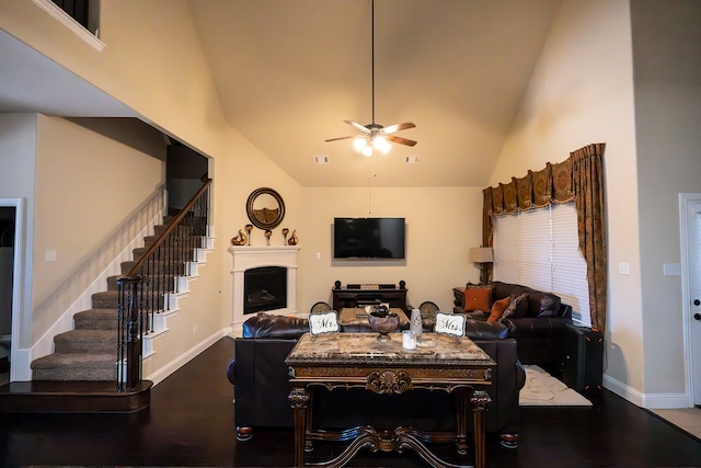 dining area with ceiling fan, high vaulted ceiling, and hardwood / wood-style flooring