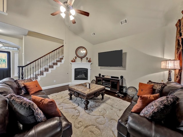 living room featuring wood-type flooring, ceiling fan, and lofted ceiling