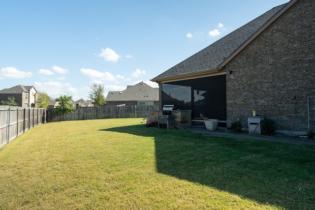 view of yard with a sunroom