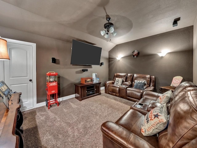 cinema with carpet, ceiling fan, and lofted ceiling