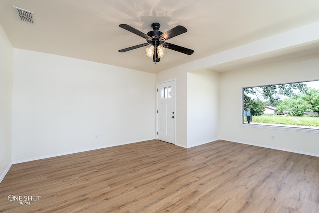 spare room with ceiling fan and light hardwood / wood-style flooring