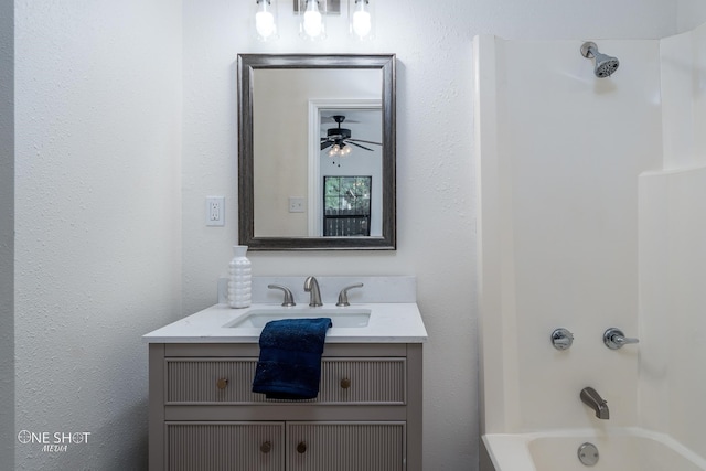 bathroom featuring shower / washtub combination, vanity, and ceiling fan