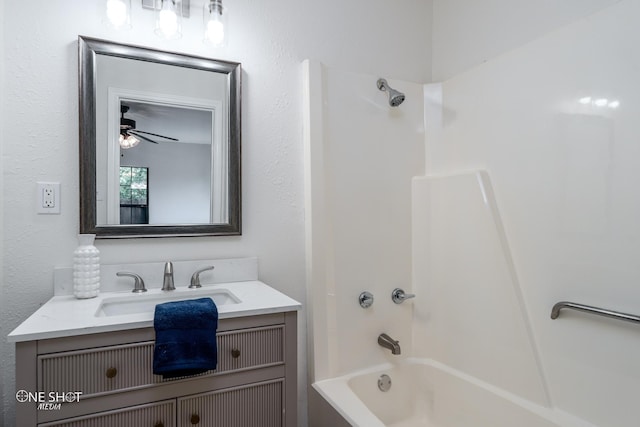 bathroom featuring vanity, shower / washtub combination, and ceiling fan