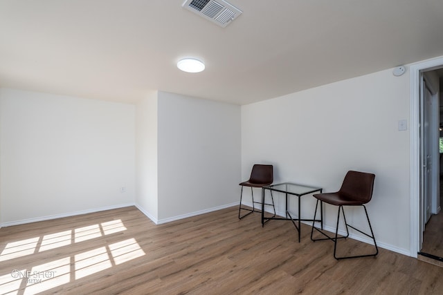 sitting room with hardwood / wood-style floors