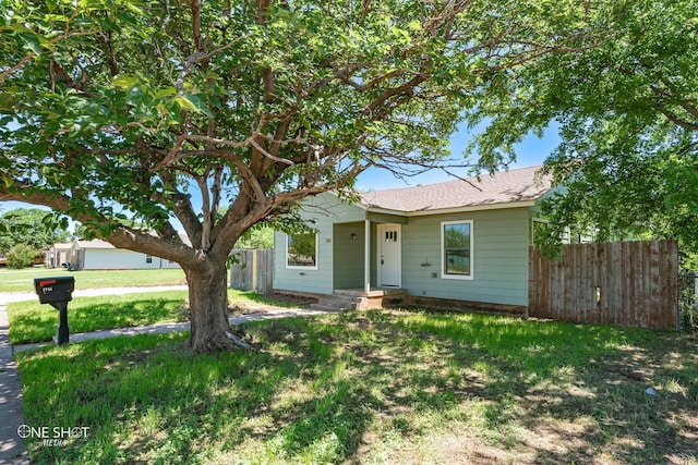 ranch-style house with a front yard