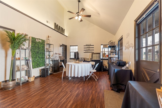 dining space with high vaulted ceiling, dark hardwood / wood-style floors, and ceiling fan