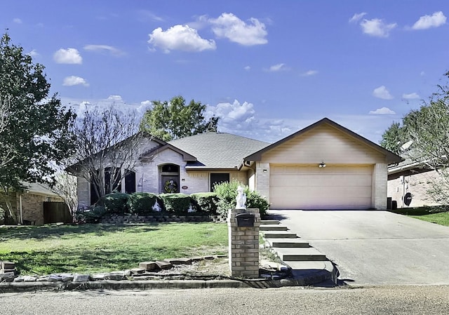 single story home featuring a garage and a front lawn