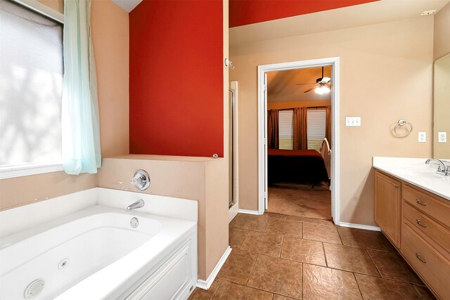 bathroom featuring ceiling fan, vanity, and shower with separate bathtub