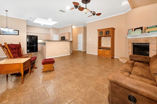 living room with a fireplace, a chandelier, and crown molding