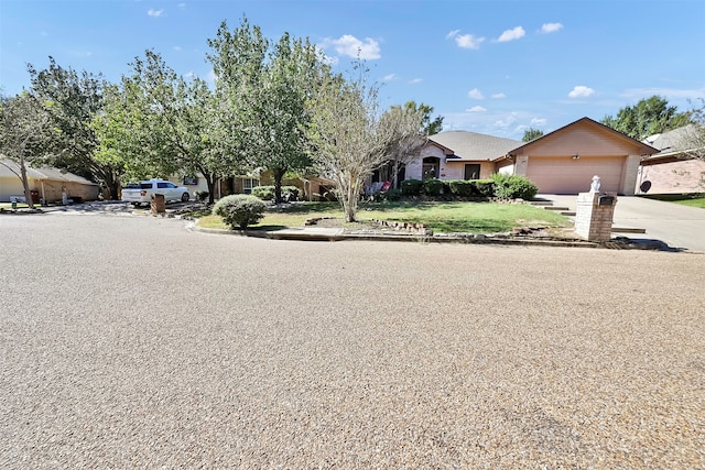 exterior space featuring a garage and a front lawn