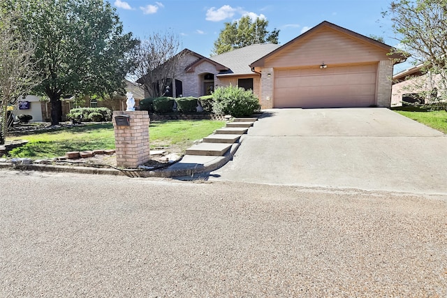 single story home with a garage and a front lawn