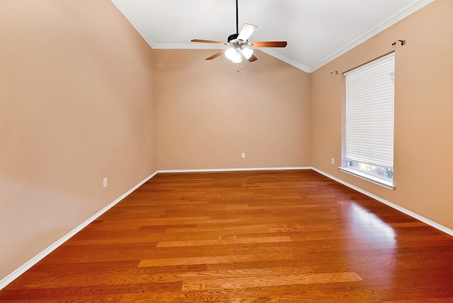 spare room with wood-type flooring, ceiling fan, crown molding, and vaulted ceiling