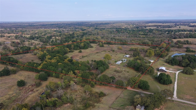 drone / aerial view with a rural view and a water view