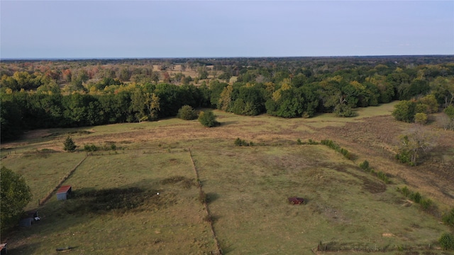 birds eye view of property with a rural view