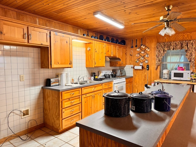 kitchen featuring light tile patterned flooring, backsplash, sink, white appliances, and ceiling fan